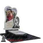 гранитный памятник в форме сердца с ангклом
